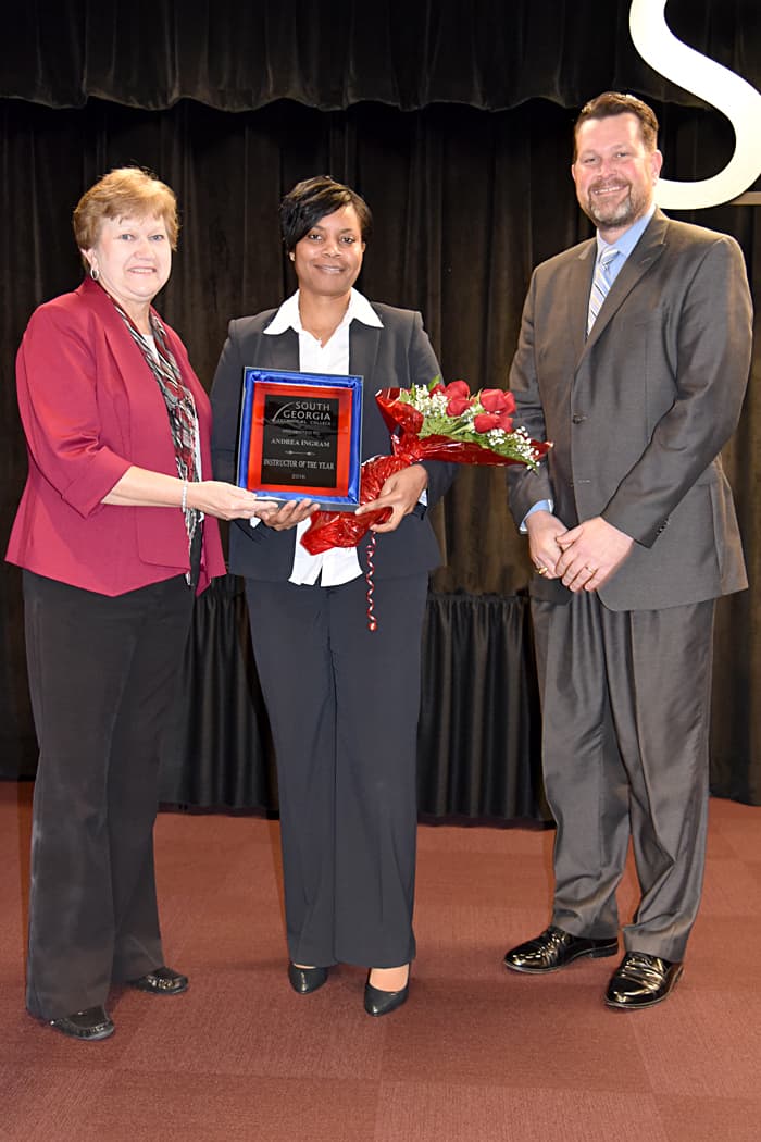 SGTC Interim President Janice Davis is shown above presenting Andrea Ingram with her Instructor of the Year plaque. Dr. John Watford, Vice President of Academic Affairs is also shown.