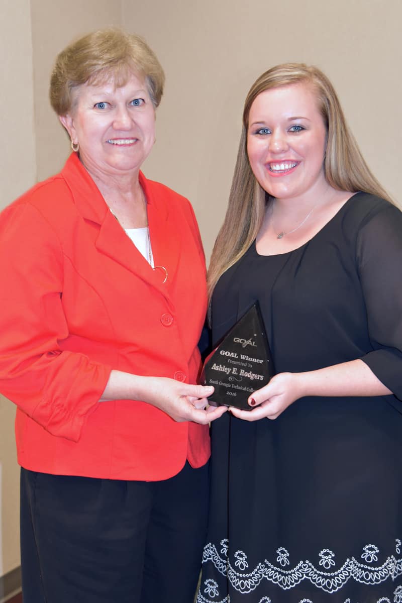 SGTC Interim President Janice Davis presents Ashley Rogers with her GOAL award.