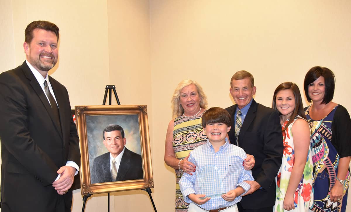 SGTC President Dr. John Watford is shown above with President Emeritus Sparky Reeves and his family.