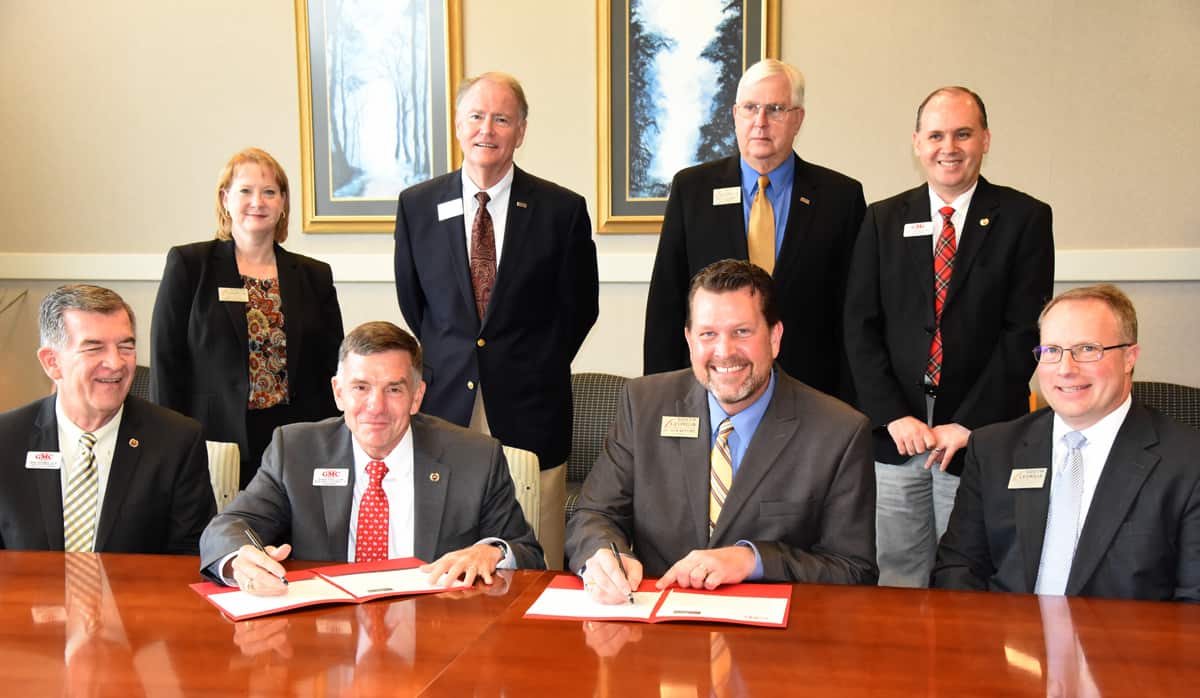 Georgia Military College President Lt. General William B. Caldwell, IV, is shown above with South Georgia Technical College President Dr. John Watford signing the articulation agreement with South Georgia Technical College. Shown seated (l to r) are GMC Senior Vice President and Chief Academic Officer Dr. Mike Holmes, GMC President Lt. General William B. Caldwell, IV, U.S. Army, Retired; South Georgia Technical College President Dr. John Watford and SGTC Vice President of Academic Affairs David Kuipers. Shown standing (l to r) are SGTC Vice President of Administrative Affairs Lea Coe, SGTC Assistant to the President Don Smith, SGTC Vice President of Economic Development Wally Summers, and GMC Associate Chief Academic Officer Dr. Derek Stone. Not shown are GMC Director of Communications Jay Bentley, GMC Public Affair Coordinator Shannon Wiggins, and SGTC Vice President of Institutional Advancement Su Ann Bird.