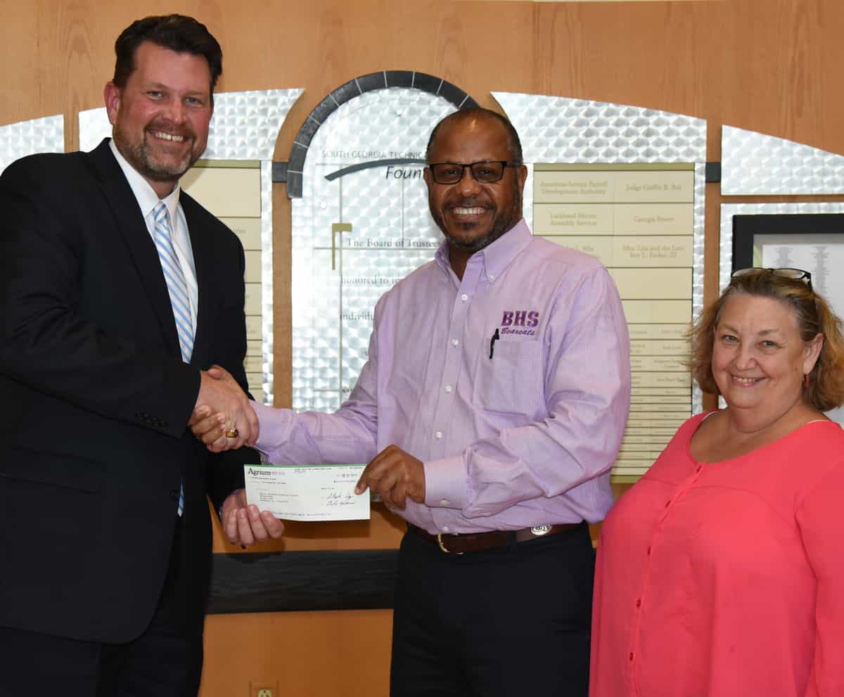 South Georgia Technical College President Dr. John Watford (l) is shown above with Ron Henderson, Agrium’s Rainbow Operations Plant Manager, and Betty Lee Scott of Agrium’s Americus office. Henderson presented Dr. Watford with a donation to the South Georgia Tech Foundation for an endowed scholarship at South Georgia Tech.
