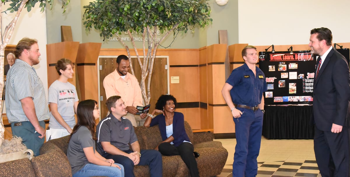 South Georgia Technical College President Dr. John Watford is shown above talking with several South Georgia Technical College students in the rotunda of the John M. Pope Industrial Technology Center on the Americus campus.