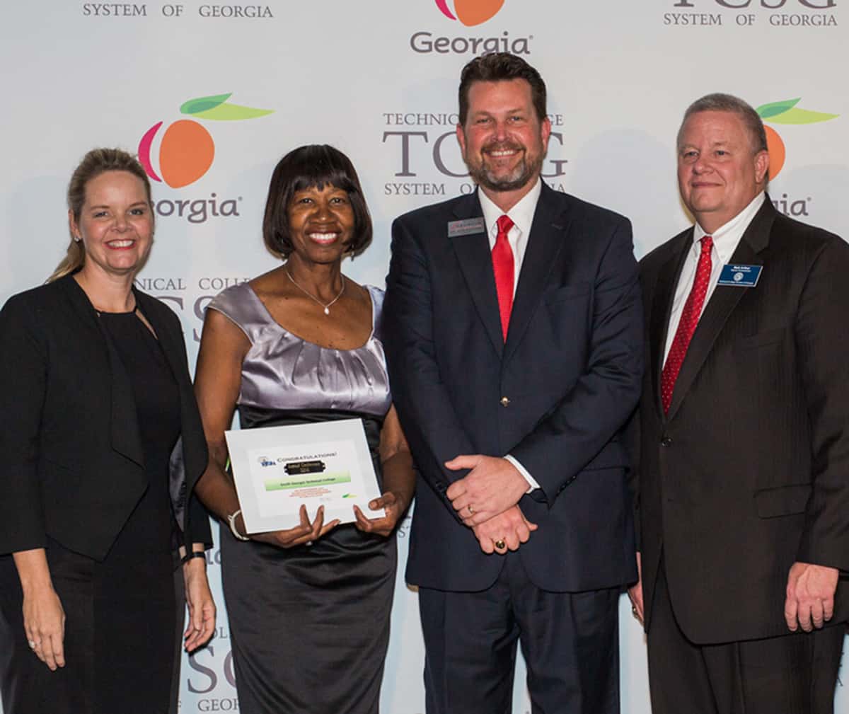 Technical College System of Georgia (TCSG) Commissioner Gretchen Corbin is shown above (l to r) congratulating South Georgia Technical College Board of Directors Chairperson Janet Siders and SGTC President Dr. John Watford for South Georgia Tech’s 2016 – 2017 Board of Directors earning their 100% certification award from the Technical College System of Georgia and the Technical College Directors Association recently. TCSG Deputy Commissioner Matt Arthur is also shown.