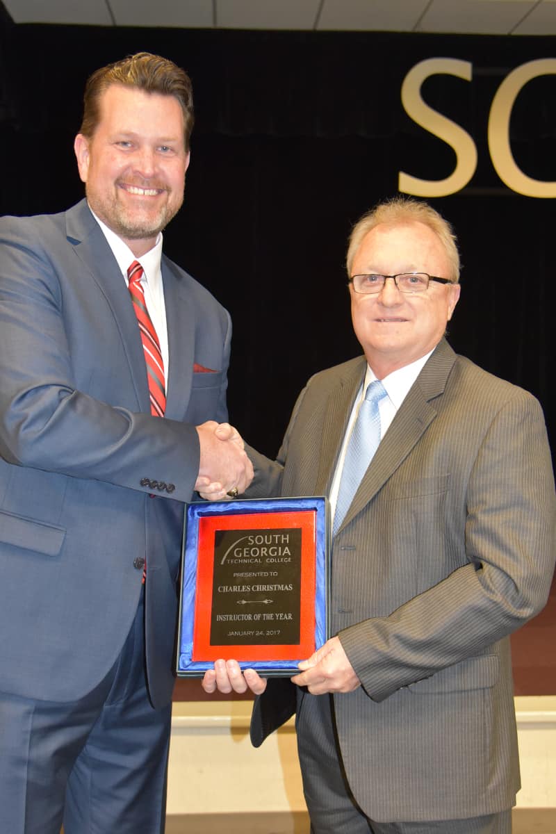 Charles Christmas (at right) is presented the 2017 Instructor of the Year Award by SGTC President Dr. John Watford.