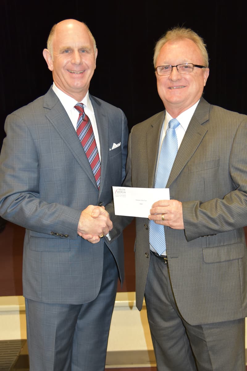 SB&T City President Barry Blount is shown above (l) presenting Charles Christmas (r) with a donation from SB&T for being selected as the South Georgia Technical College 2017 Instructor of the Year.