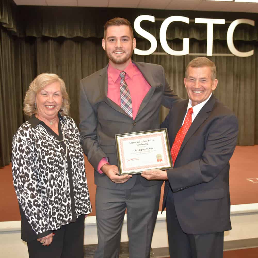 South Georgia Technical College President Emeritus Sparky Reeves (r) and Allene (l) are shown above presenting a scholarship to the SGTC 2017 GOAL winner, Christopher McGee (c).
