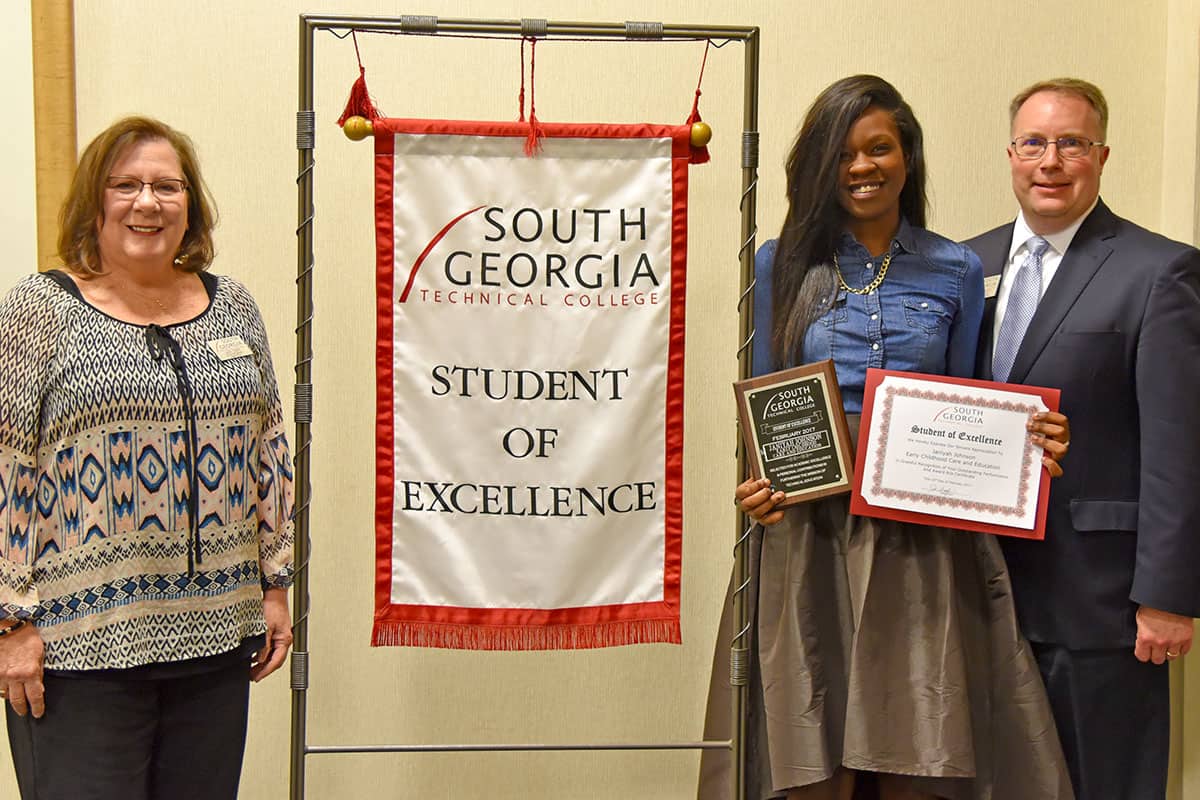 Janiyah Johnson (center) is pictured with SGTC Vice President for Academic Affairs David Kuipers (at right) and her nominating instructor Jaye Cripe (far left).