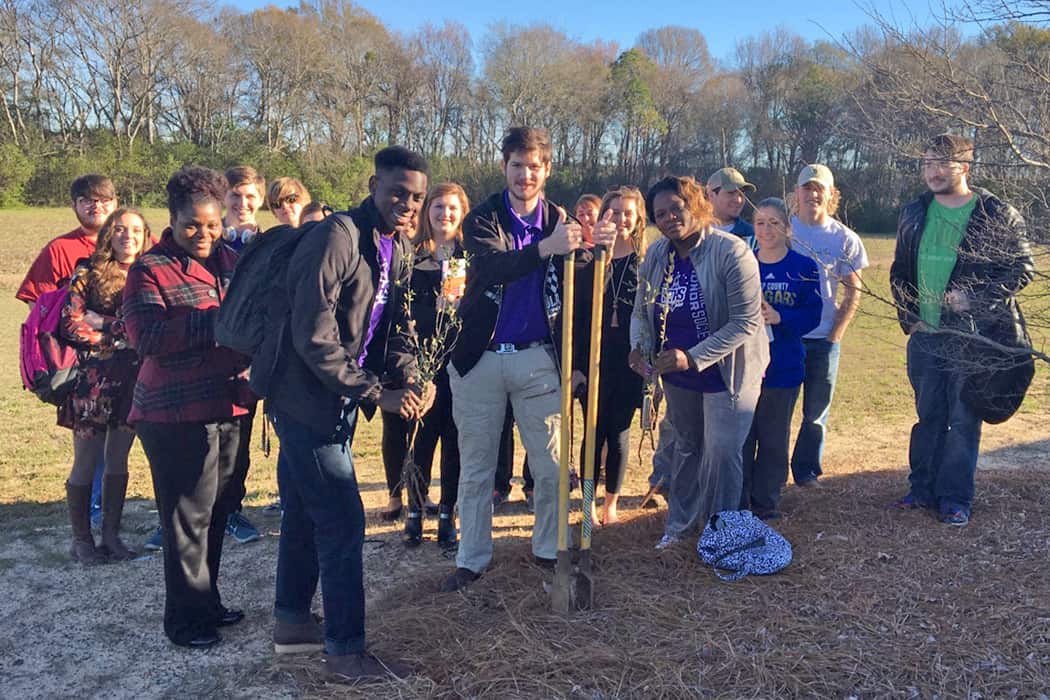 SGTC NTHS advisors, members, and MOWR students are pictured planting a tree on SGTC’s Crisp County Center campus in honor of Georgia Arbor Day.
