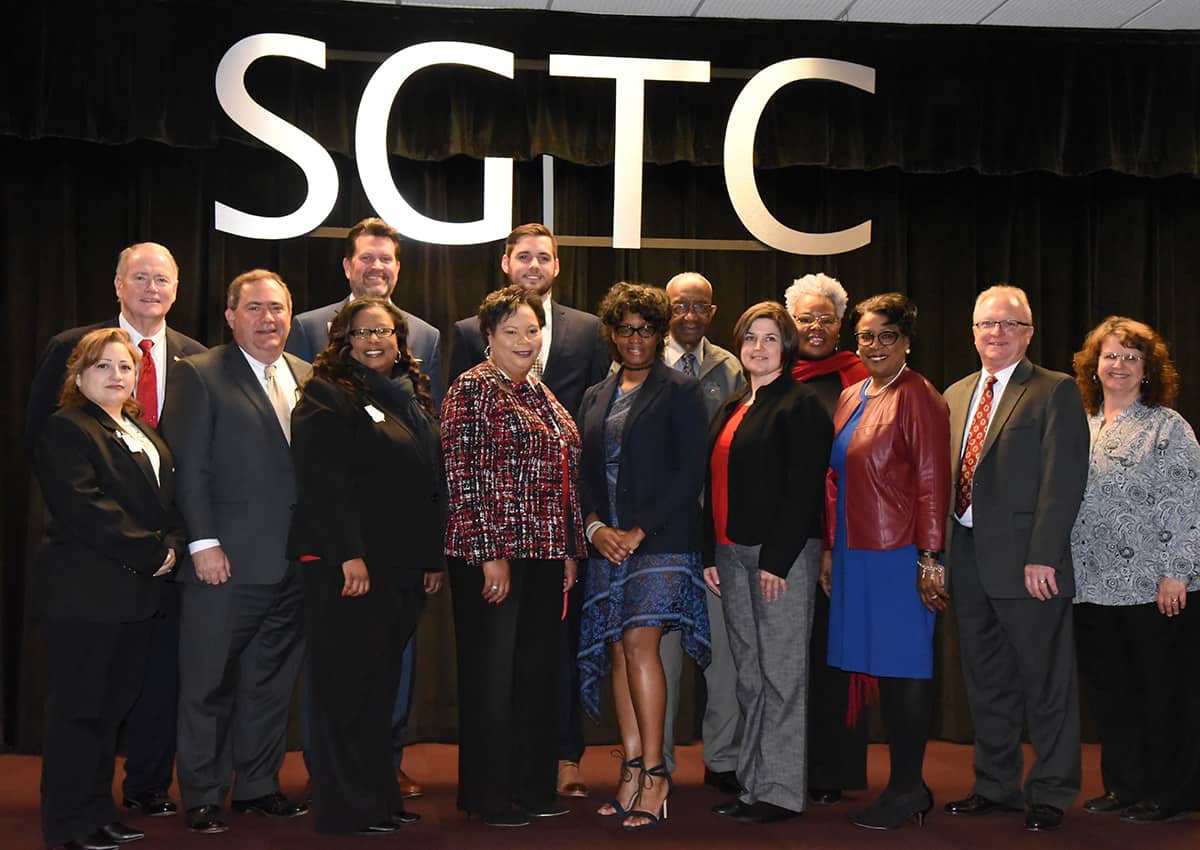 Eshonda Blue (center) is pictured with the African American History Program committee and other program participants. Pictured from left to right on the front row are Maria Rivera, NTHS President/state officer; Paul Farr, SGTC Director of Business and Industry Services; Dr. Michele Seay, SGTC Psychology Instructor; Teresa O’Bryant, Executive Assistant to the President; Eshonda Blue; Victoria Herron, SGTC Aviation Maintenance Instructor; Cynthia Carter, SGTC Director of Career Services; Charles Christmas, SGTC Aviation Maintenance Instructor and 2017 Instructor of the Year; and Vanessa Wall, Dean for Academic Affairs. On the back row from left to right are Don Smith, SGTC Special Assistant to the President; Dr. John Watford, SGTC President; Christopher McGee, SGTC 2017 GOAL Winner; Willie Patrick, SGTC Board of Directors member and member of the SGTC Foundation Board of Trustees; and Dorothea Lusane-McKenzie, Cosmetology instructor.