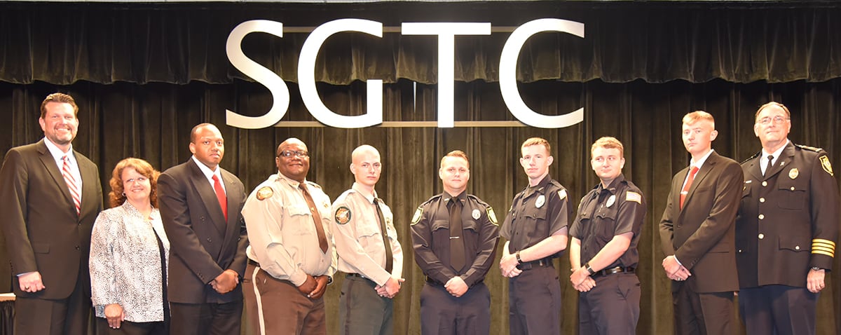 South Georgia Technical College President Dr. John Watford and SGTC Academic Dean Vanessa Wall (l to r) are shown above with Americus Police Chief Mark Scott (far right) and members of the SGTC Law Enforcement Academy class 17-01