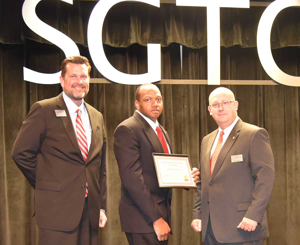 South Georgia Technical College President Dr. John Watford is shown above with the SGTC Lou Crouch Scholarship winner from Class 17-01, Quinntin Ja’Colby Mann from Americus, Georgia. Also shown is SGTC Law Enforcement Academy Director Brett Murray.
