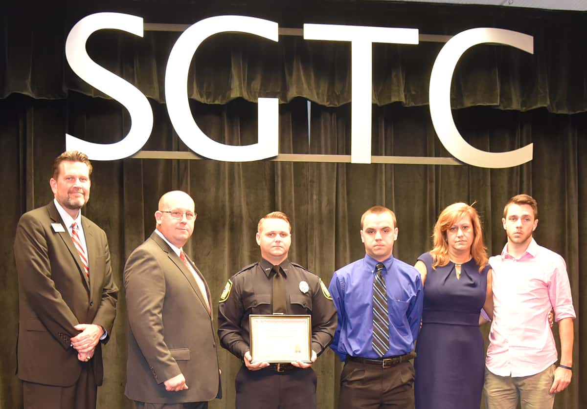 South Georgia Technical College President Dr. John Watford is shown above (l to r) with SGTC Law Enforcement Academy Director Brett Murray, the Smallwood-Sondron Scholarship Class 17-01 Winner and Class Representative Christopher J. Gaddy, and members of the Sondron family from Peach County. They included Patrick Sondron’s sons, Jacob and Ethan and his wife, Melissa Sondron. Lou Crouch, who endowed the scholarship, was unable to attend the ceremony.