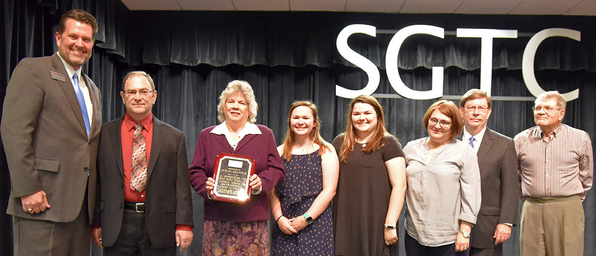 South Georgia Technical College President Dr. John Watford is shown above presenting Wray Skipper and his wife Elaine with an appreciation plaque in honor of his retirement. Also shown with Wray and Elaine are their two daughters Valerie and Kelsey, sister-in-law and brother Dianna and Jimmy Skipper and cousin Marvin Nation.