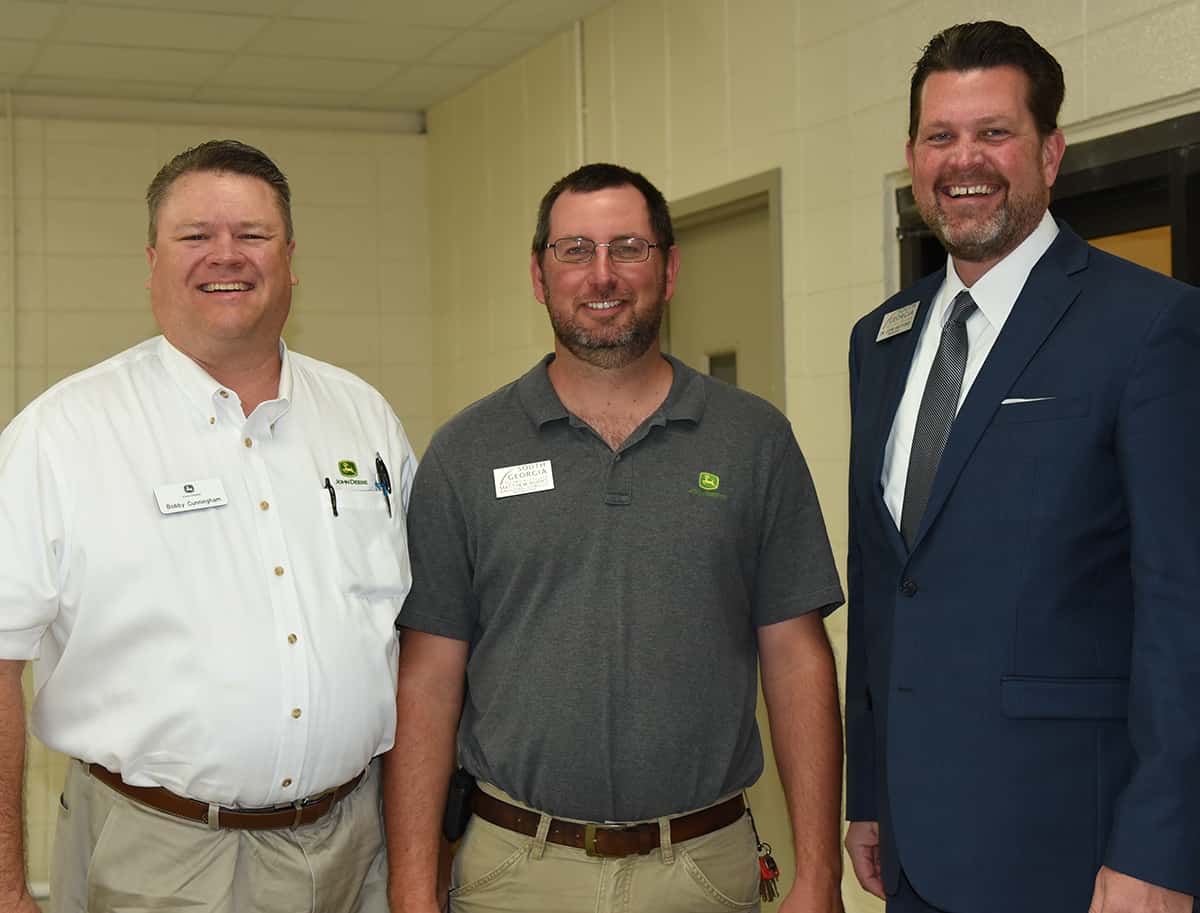 South Georgia Technical College President Dr. John Watford (r) is shown above with Bob Cunningham (l) from John Deere and SGTC John Deere Ag Tech instructor Matthew Burke