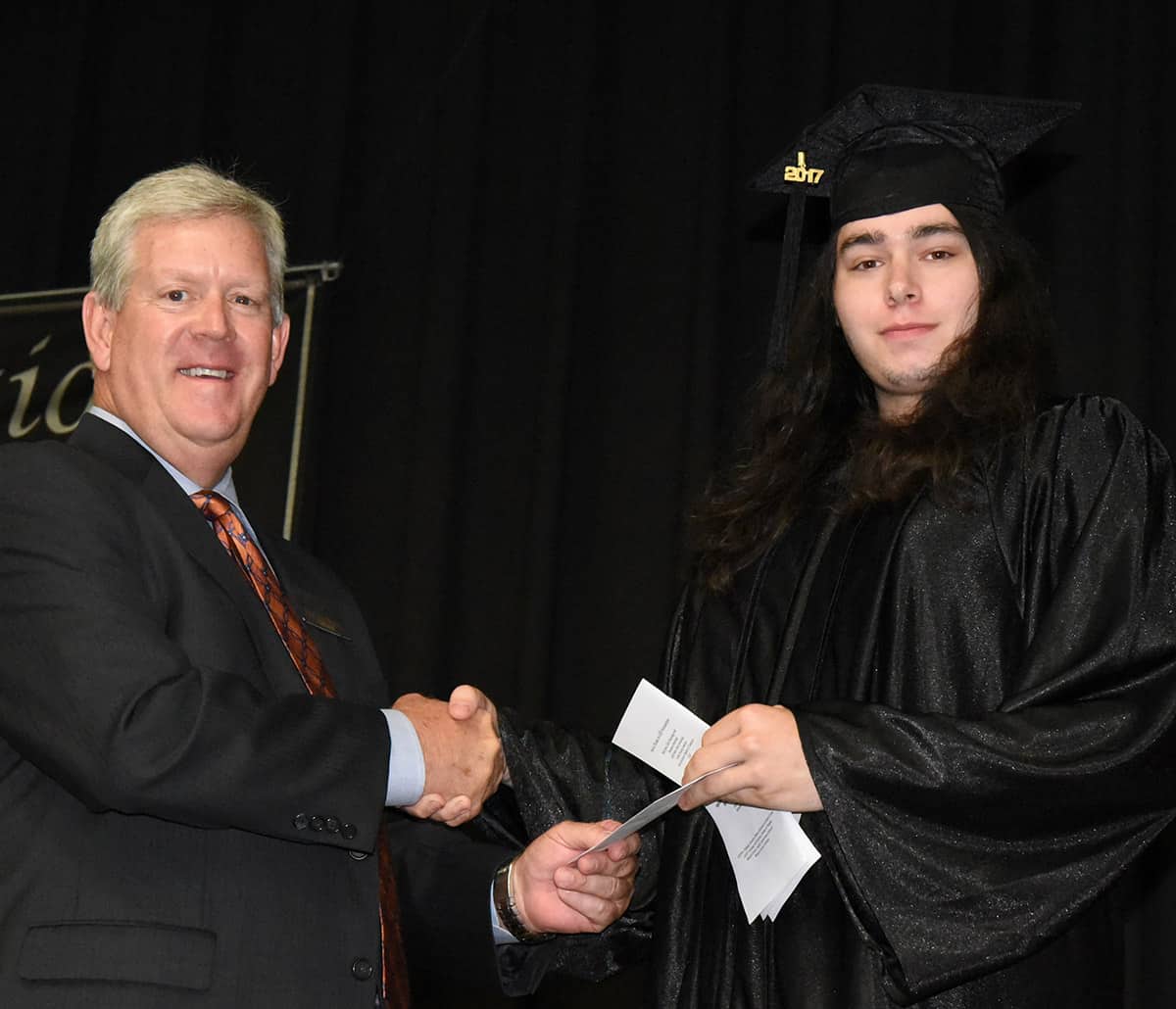 Jay Roberts, Board member of the Americus Sumter County Chamber of Commerce (l), is shown above with Charles Flakes