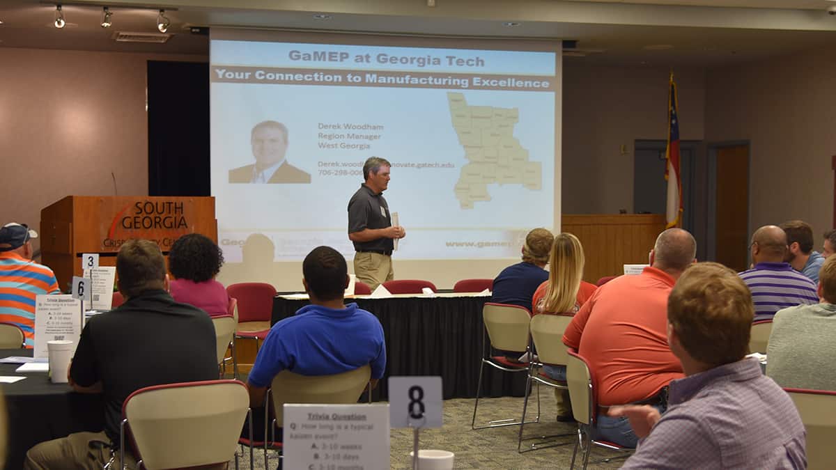 The Georgia Manufacturing Extension Partnership (GaMEP), a division of Georgia Tech’s Enterprise Innovation Institute, presented a lunch and learn workshop called How to Run a Successful Kaizen Event for Cordele area business and industry at South Georgia Tech’s Crisp County Center recently. Derek Woodham is pictured talking to attendees about GaMEP.
