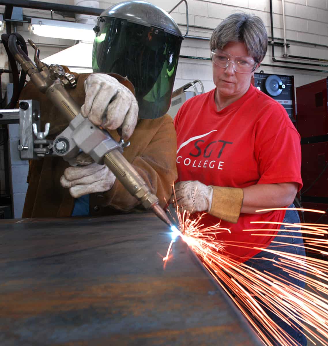 SGTC Crisp County Center Welding Instructor Brenda Butler Gilliam (r) is shown above instructing a student on proper welding techniques.