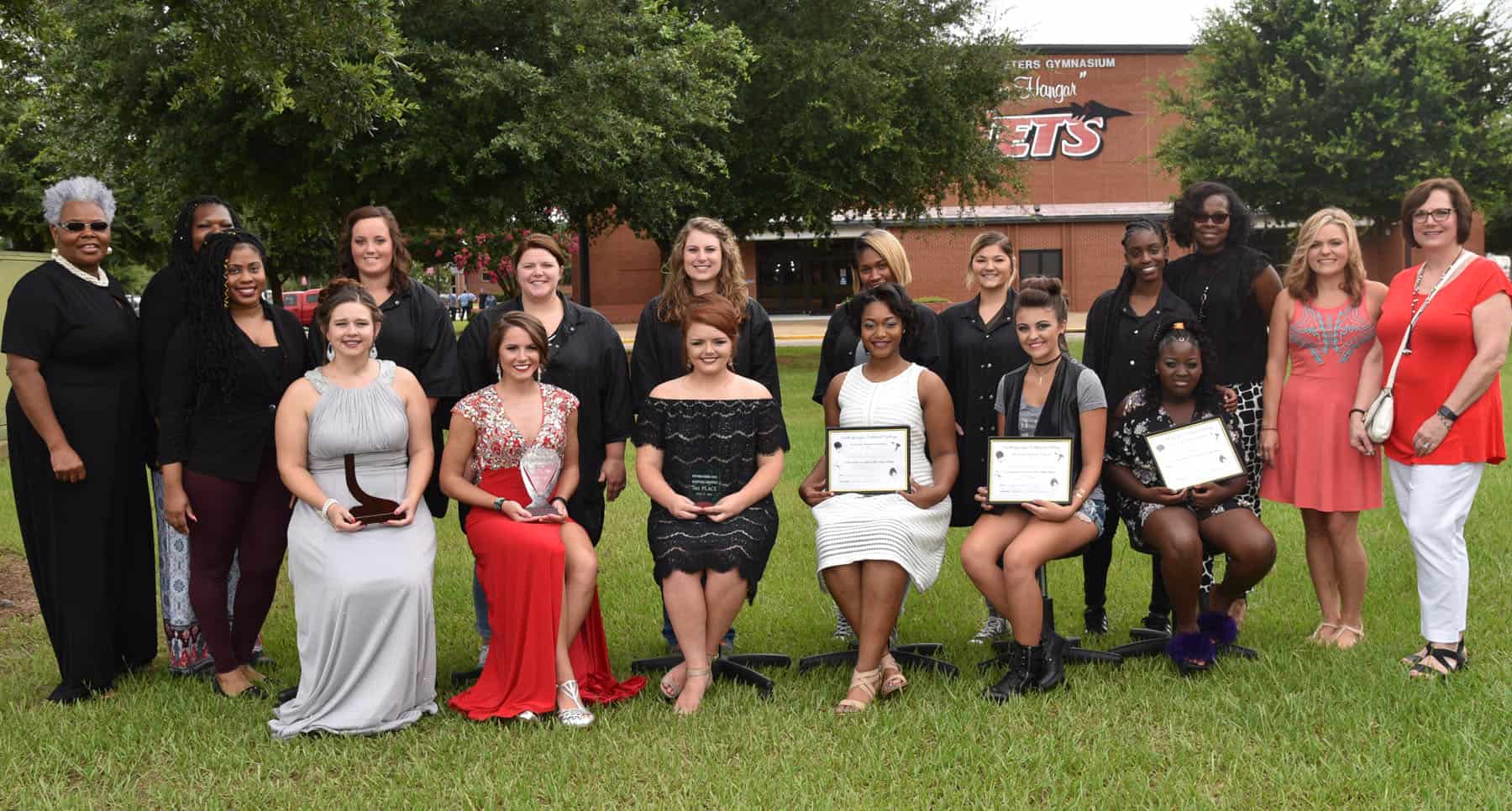 Shown above are the South Georgia Technical College Instructors and winners from the Cosmetology Hairstyling Contest with the judges. They are (standing l to r): SGTC Cosmetology Instructors Dorothea Lusanne McKenzie and Airel Rolle and Instructor trainee Jessakeetha Maddox; first place winner Frances Gill, second place finisher Morgan Whaley, the third place winner Tatum Brown, fourth place contestant Ambrea Hill, Jenna Gill who finished in fifth place, and Jamirah Johnson, the sixth place winner. Also shown are judges Patricia McClary Harris, Audrey Pacetti Wellons and Laura Faircloth. Shown seated (l to r) are the models: Savannah Gill, Ella Hawkins, Kambry Curles, Trenidee Sanford, Trinity Jenkins and Carlexia Wiggins.