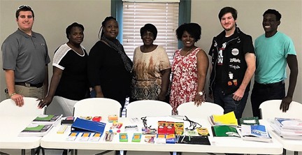 NTHS members pose in front of goods that they collected