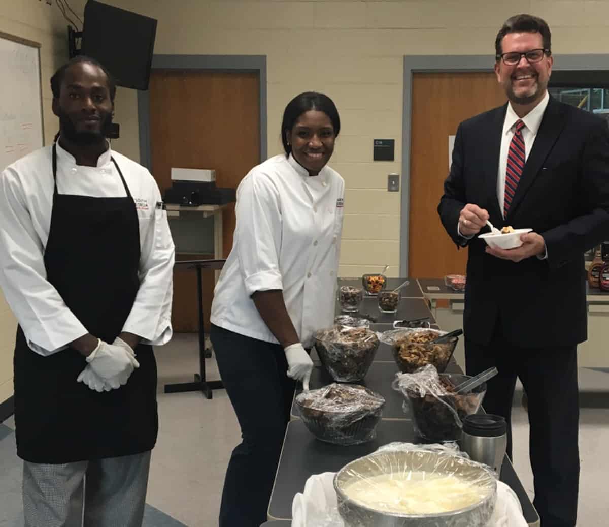 Dr. John Watford pose with culinary students