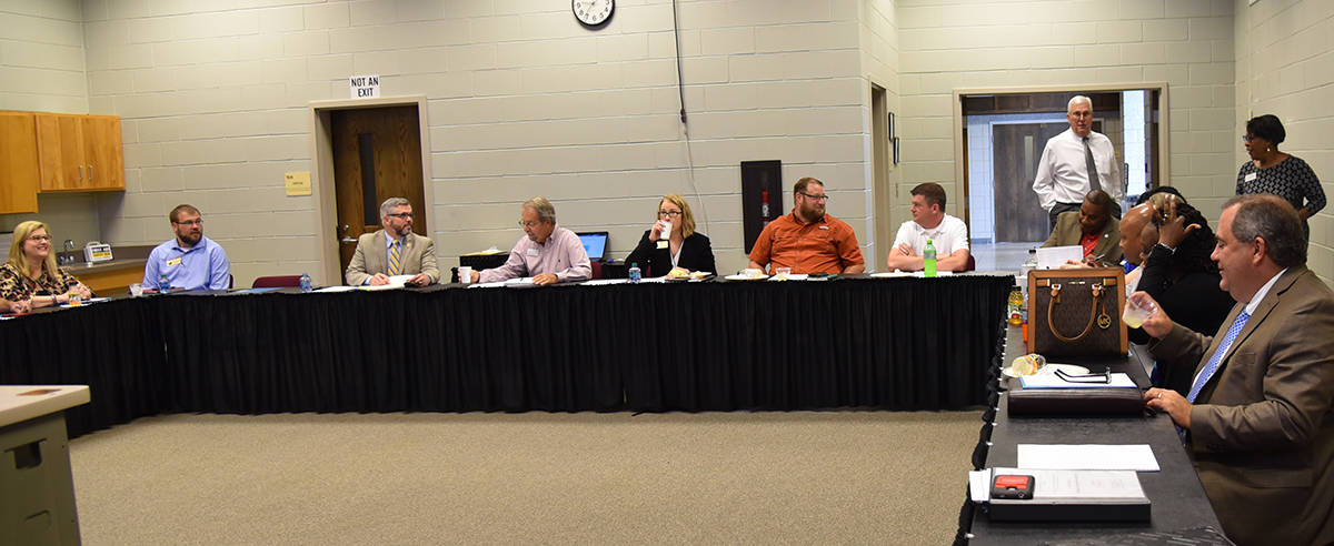 SGTC Vice President of Economic Development Wally Summers and SGTC Director of Career Services Cynthia Carter are shown above standing talking to members of the Southwest Georgia Employment Committee