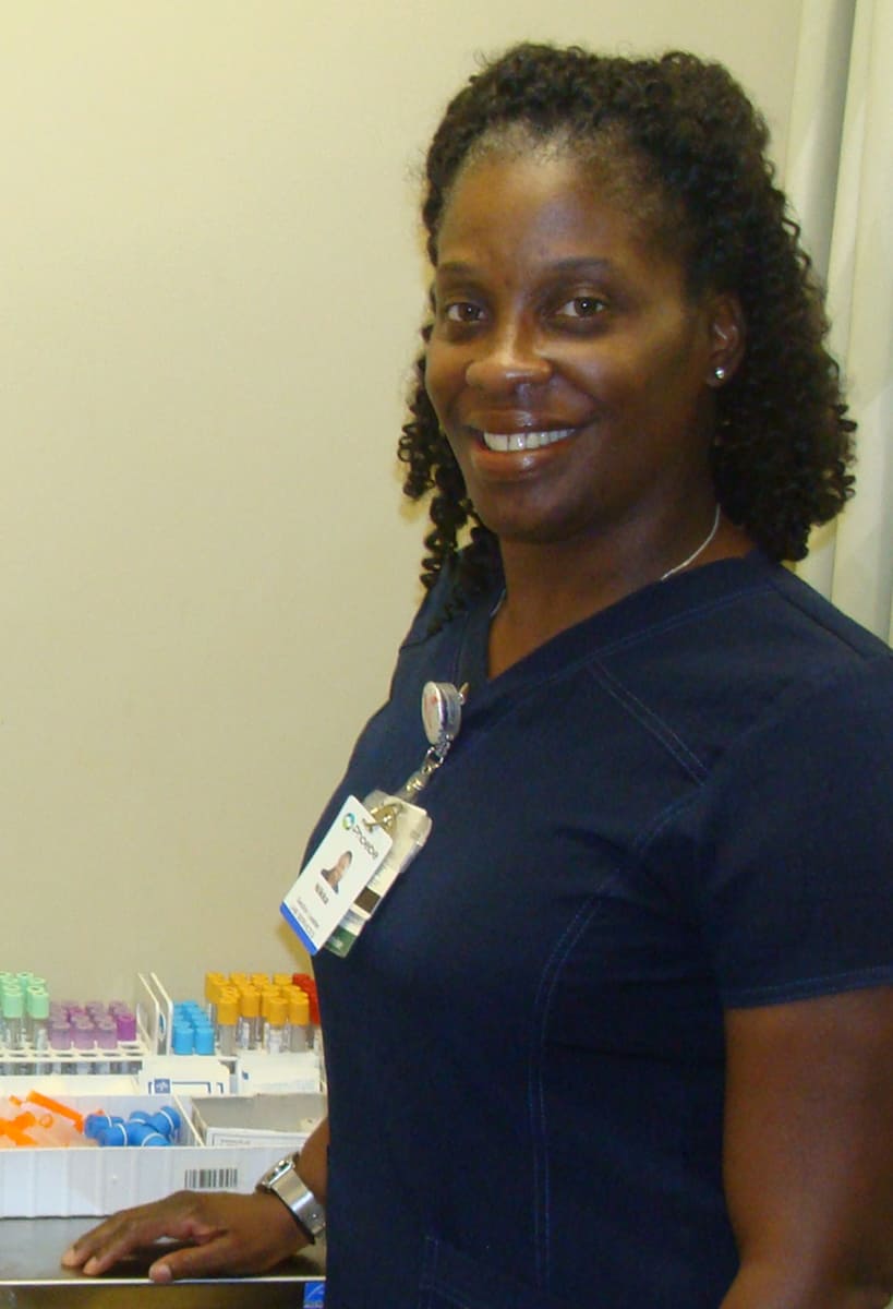 Nikka Harris, SGTC Adjunct Instructor of Phlebotomy and Phoebe Sumter employee, is shown smiling for a picture on the job.
