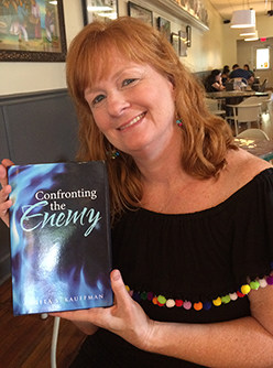 Angie Kauffman poses with her new book