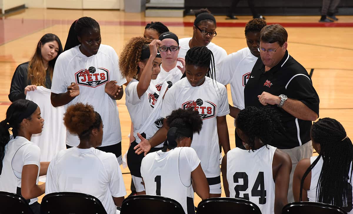 Lady Jets head coach James Frey talks with team before Albany State scrimmage game.