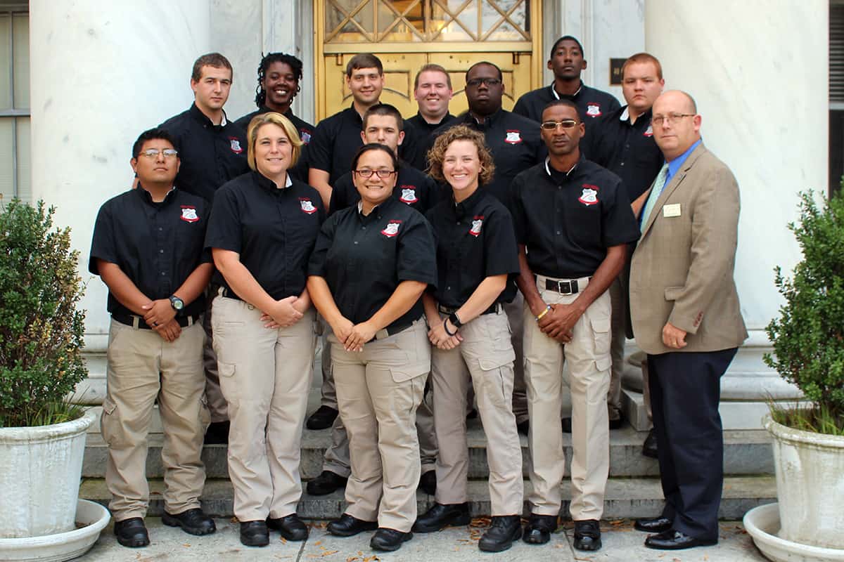 The Law Enforcement Academy class stands on the steps of the Georgia Supreme Court. Pictured front row (Left to Right): David Rueda-Fierros, Brandy Stokes, Claudia Tupper, Taylor Mills, Jeffery Bell and Academy Director Major Brett Murray. Back Row (Left to Right): Ruric Slocumb, Cora Baker, Justin Lewis, Tyler Adams, Nathan Brown, Anthony Davis, Odell Williams and Austin Spence. Cadet Matthew Robinson and Chief Vanessa Wall are not pictured.