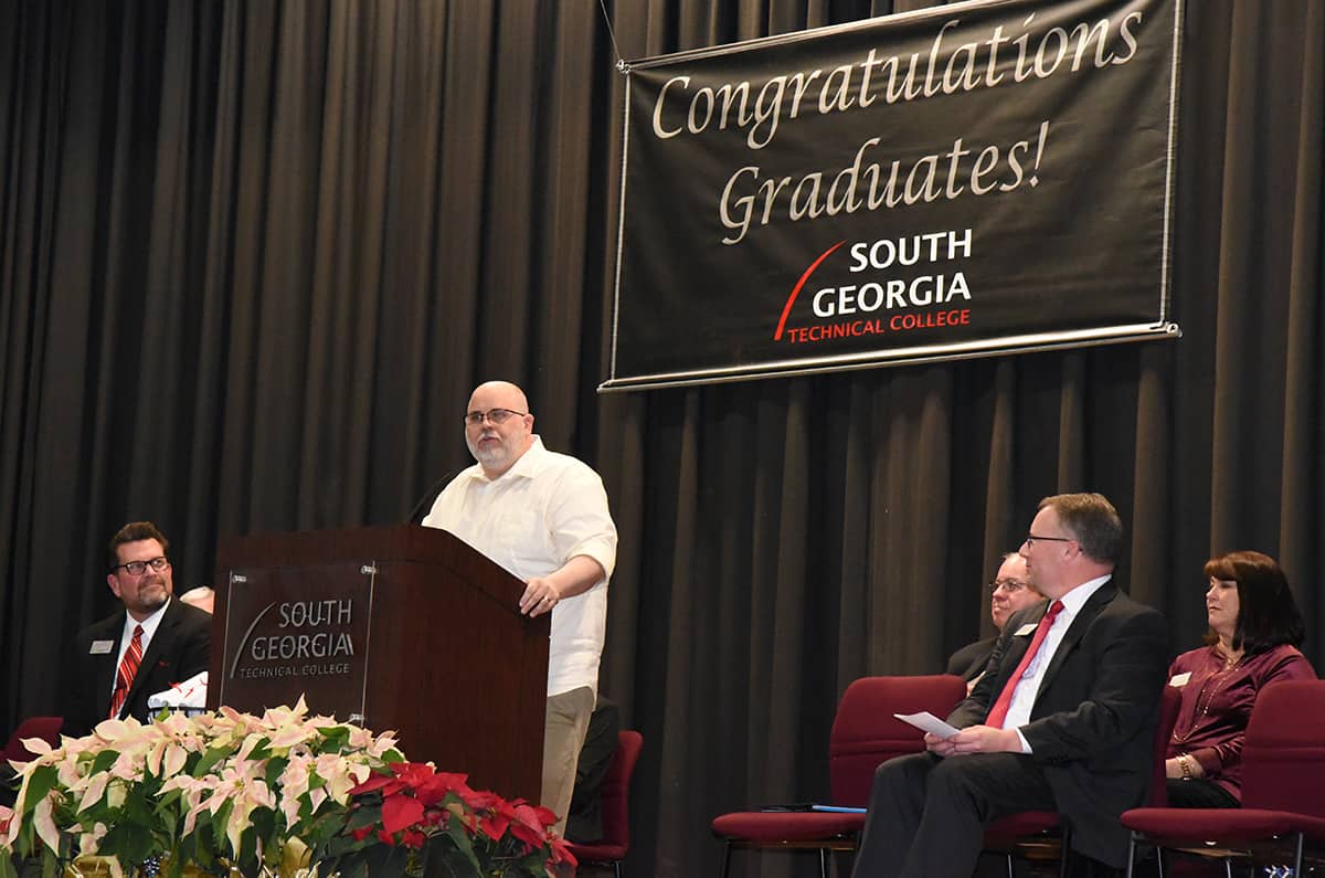 Shown above is Georgia Southwestern State University Assistant Professor of Sociology Dr. Joseph A. Comeau speaking to the South Georgia Technical College 2017 Fall GED graduation ceremony. Also shown are SGTC President Dr. John Watford, SGTC Vice President of Academic Affairs David Kuipers, Rev. Michael Truitt, and SGTC Vice President of Student Affairs Karen Werling.