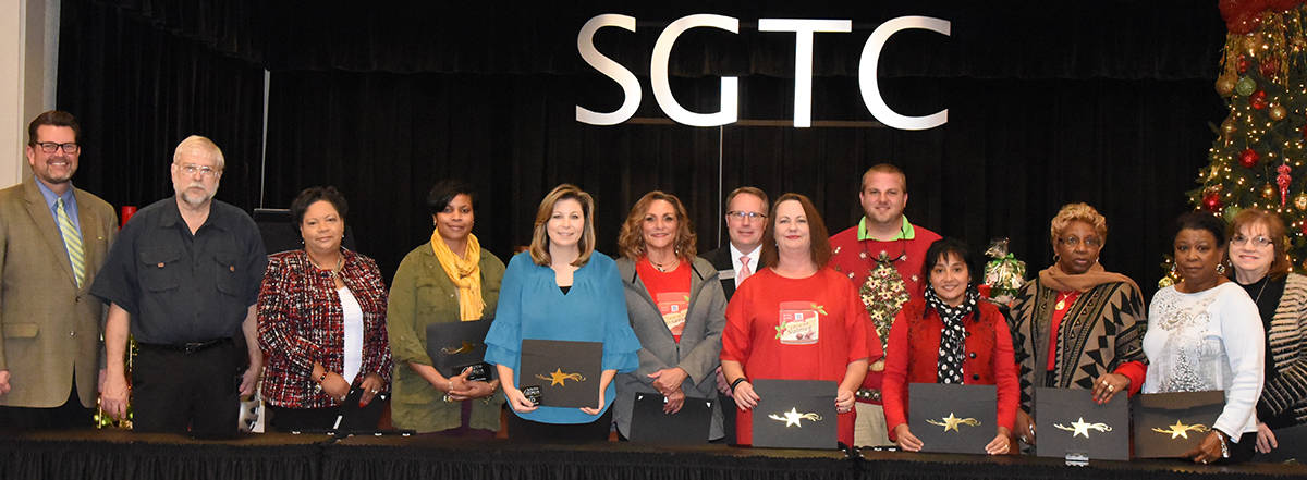 SGTC President Dr. John Watford is shown above with some of the SGTC employees who were recognized at the employee luncheon for reaching a milestone with the college this year. The college recognized 25 employees with over 337 years of service to students. Shown with Dr. Watford are Jerry Stovall, Teresa O’Bryant, Andrea Ingram, Sandy Larson, Penny Pace, David Kuipers, Kari Bodrey, Kyle Hartsfield, Kenia Willis, Gloria Bell, and Cathy Freeman.