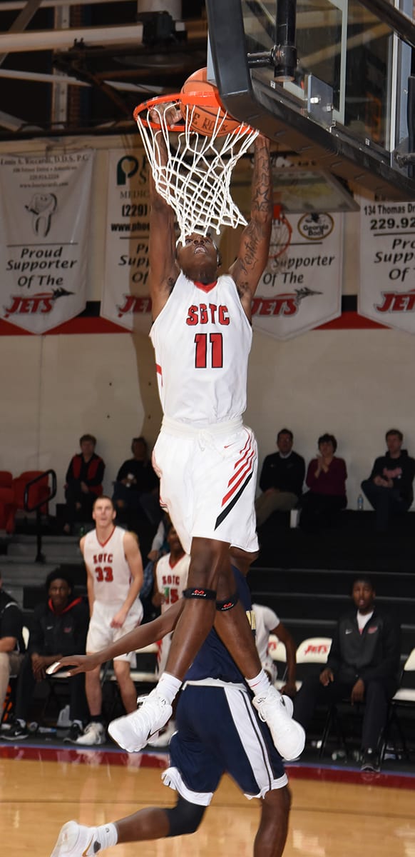 Dawan Bass, 11, is shown dunking for the Jets in the win over Wake Tech.