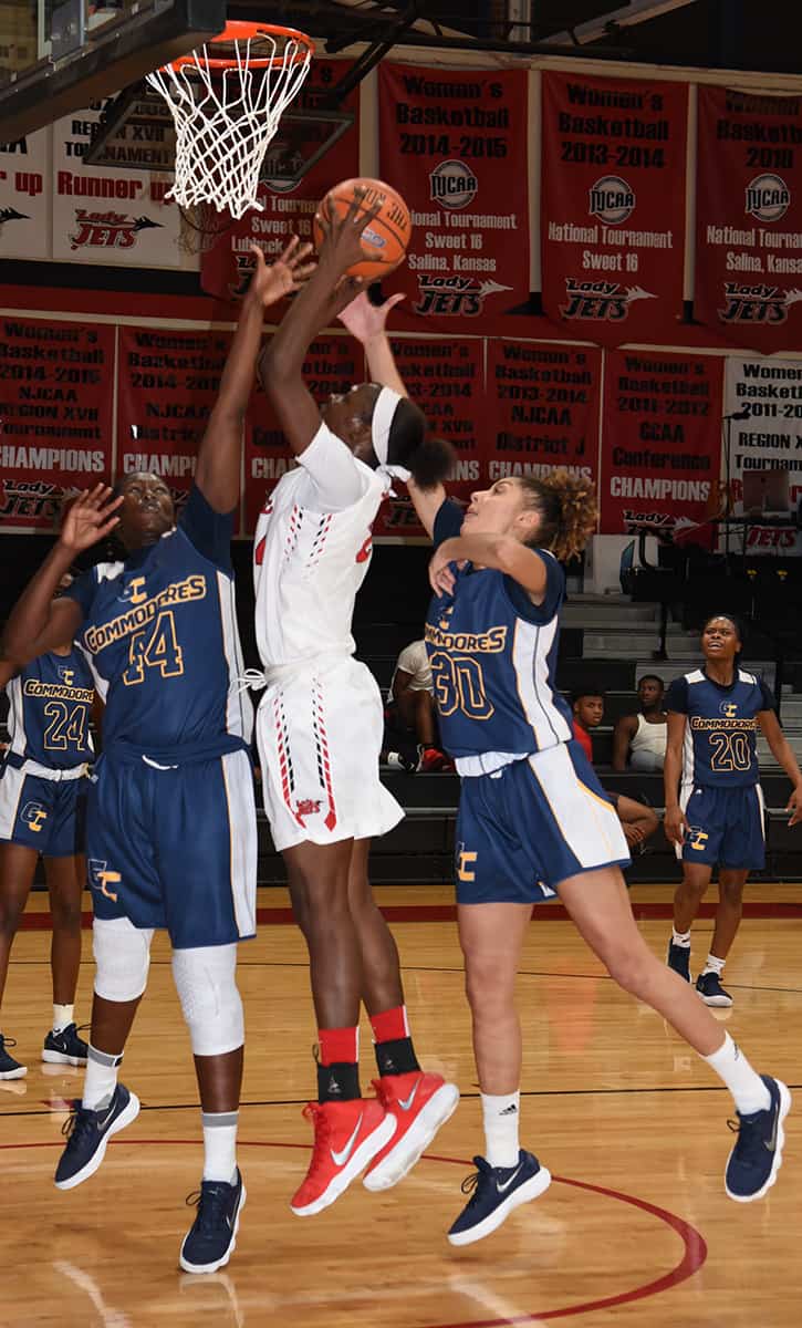 Lady Jets Esther Adenike (24) is shown going up for a shot against Gulf Coast.