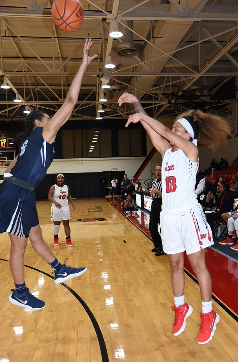 Alyssa Nieves, 13, is shown hitting a three-point shot for the Lady Jets.