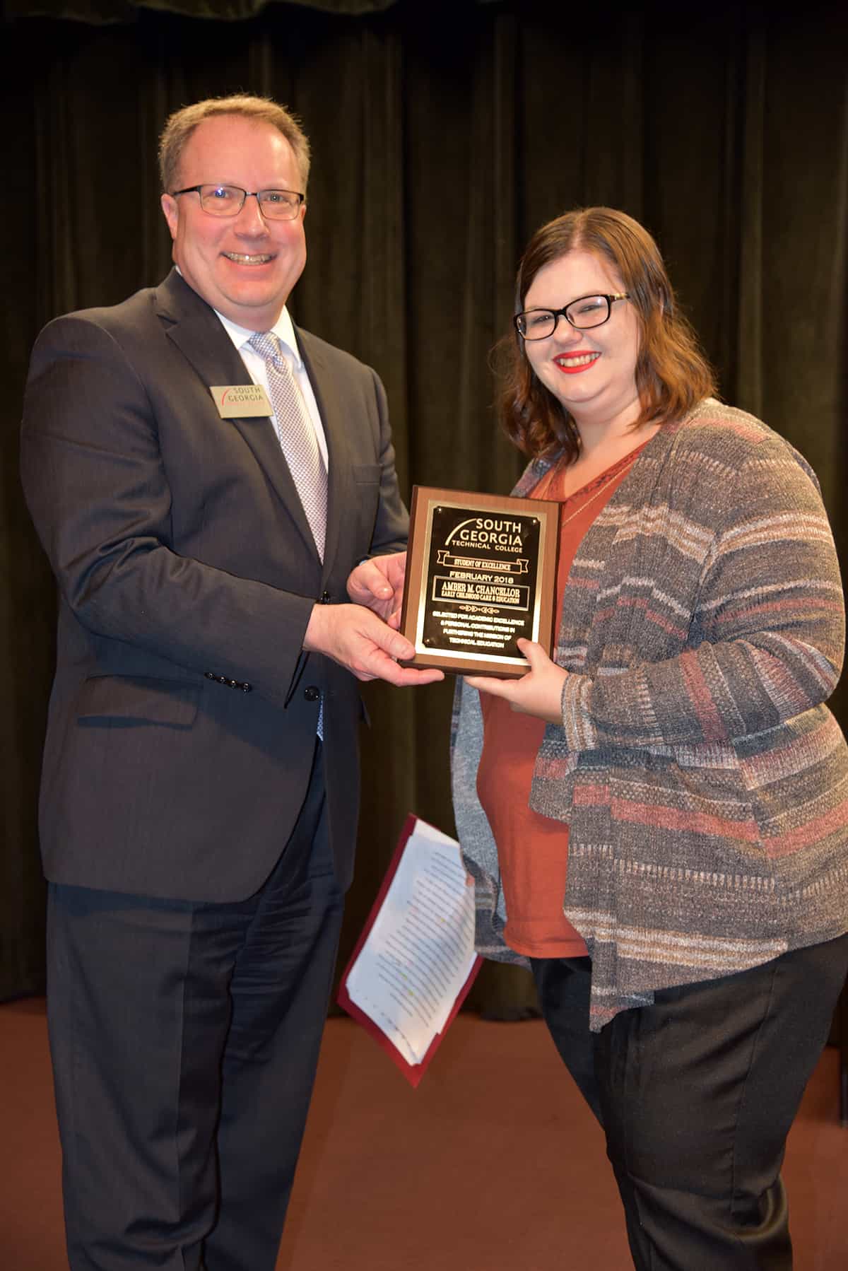 February 2018 Student of Excellence winner Amber Chancellor, right, accepts her award from South Georgia Technical College Dean of Academic Affairs David Kuipers.