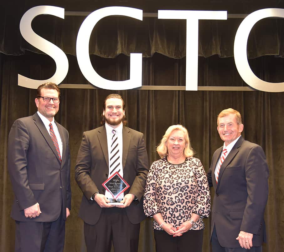 South Georgia Technical College President Dr. John Watford is shown above with the SGTC 2018 GOAL winner, Noah McCleskey from Pinehurst as SGTC President Emeritus Sparky Reeves (r) and Allene (right center) are shown above presenting a scholarship check to 2018 GOAL winner McCleskey.