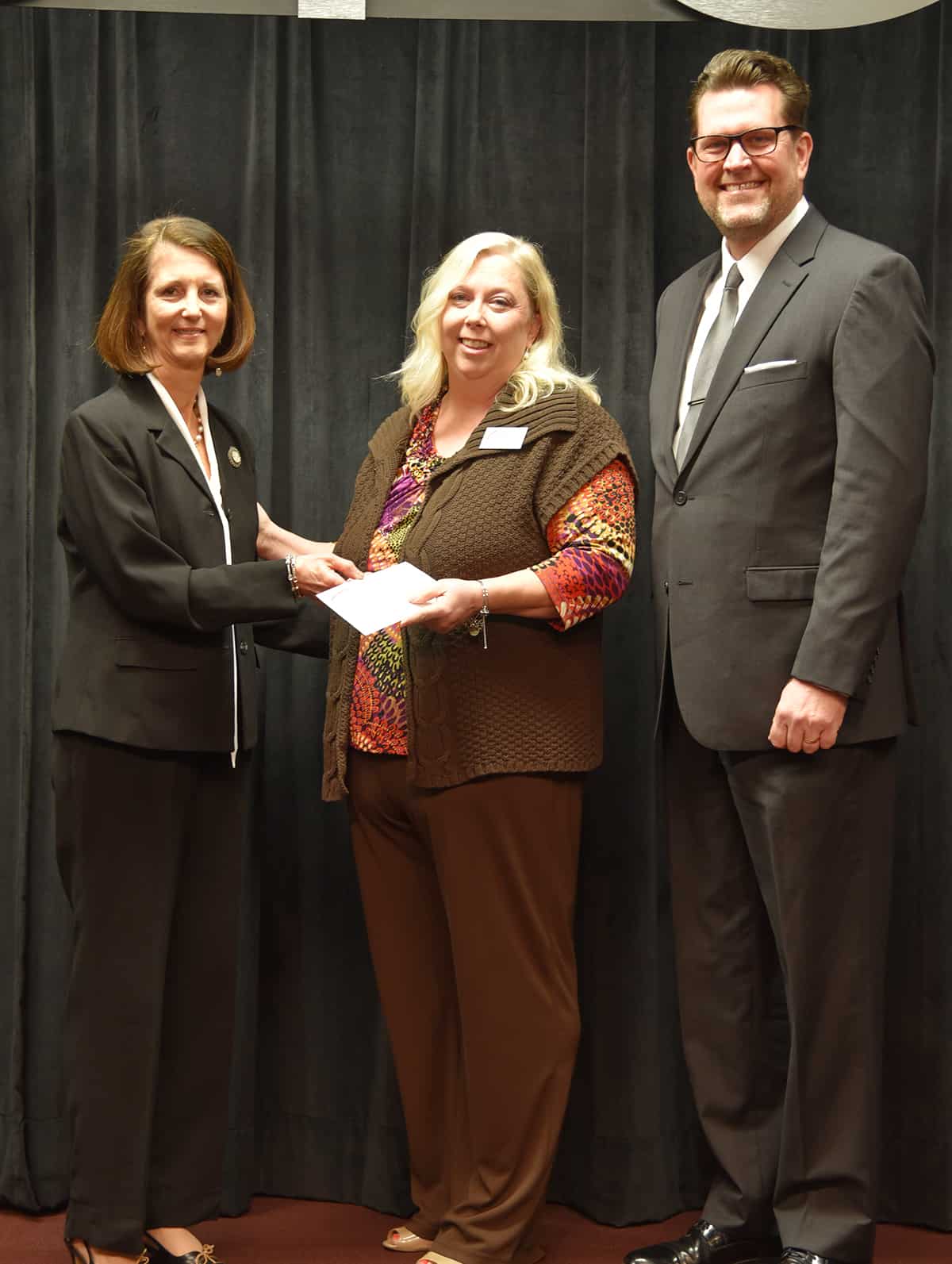 SB&T’s Tami Duke is shown above (l to r) presenting Teresa McCook with a donation from SB&T for being selected as the South Georgia Technical College 2018 Instructor of the Year. Dr. John Watford, SGTC President is also shown thanking Duke and SB&T for their support of the college and its instructors.