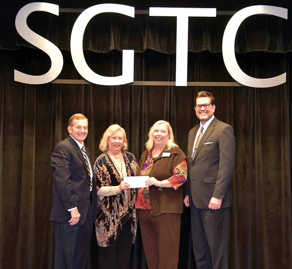 South Georgia Technical College President Emeritus Sparky Reeves (l to r) and Allene, are shown above presenting a check to SGTC 2018 Instructor of the Year Teresa McCook. SGTC President Dr. John Watford is also shown thanking the Reeves and Teresa McCook on her recognition.