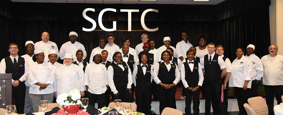 Shown above are SGTC Dean of Academic Affairs over Culinary Arts Dr. David Finley and Culinary Arts Instructor Ricky Watzlowick with the Americus and Crisp County Center Culinary Arts students who helped prepare and serve at the South Georgia Technical College Foundation Donor Appreciation Dinner recently.