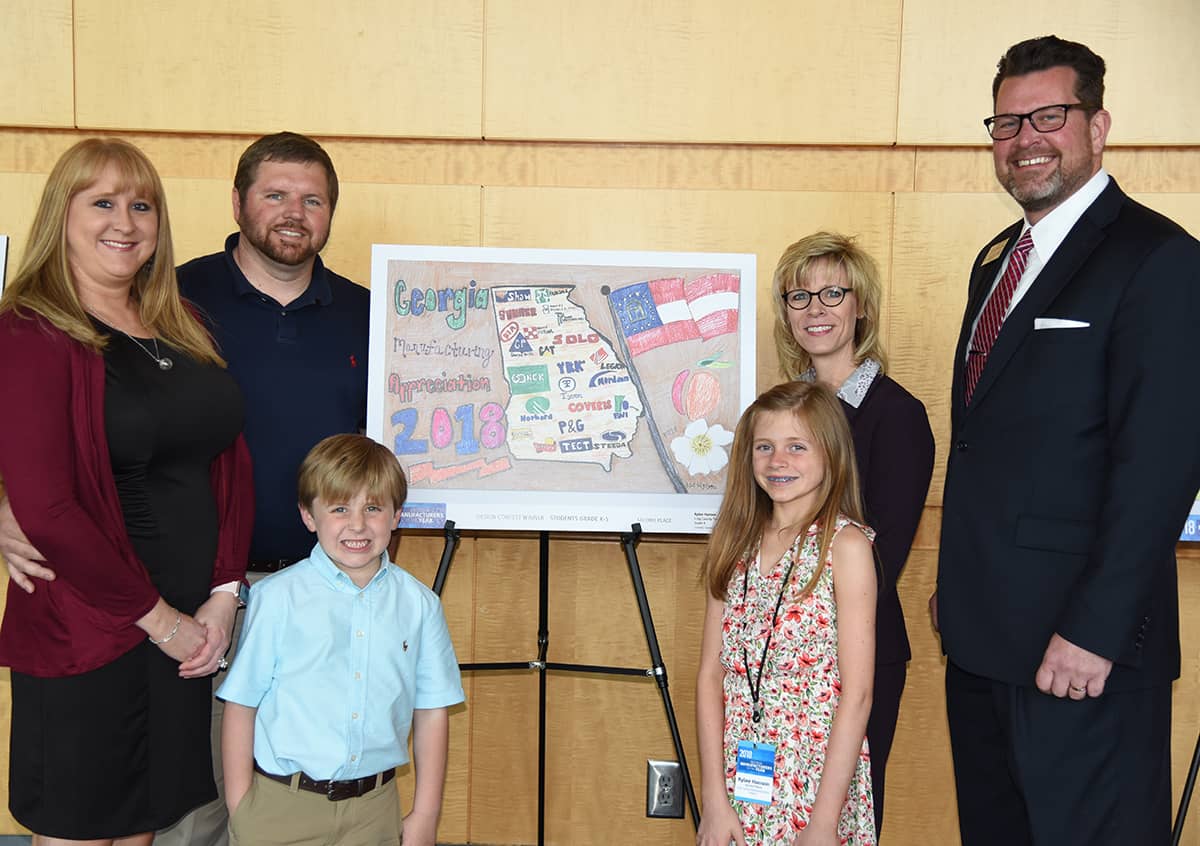 South Georgia Technical College President Dr. John Watford (right) and Julie Partain, Dean of Enrollment Management at the SGTC Crisp County Center, are shown above with MAW Statewide Art Contest winner Rylee Hanson of Crisp County Elementary School with her 2nd place poster in the K – 5th grade competition. Also shown (l to r) are Rylee’s parents Kimberly and Tony Hanson and her brother.
