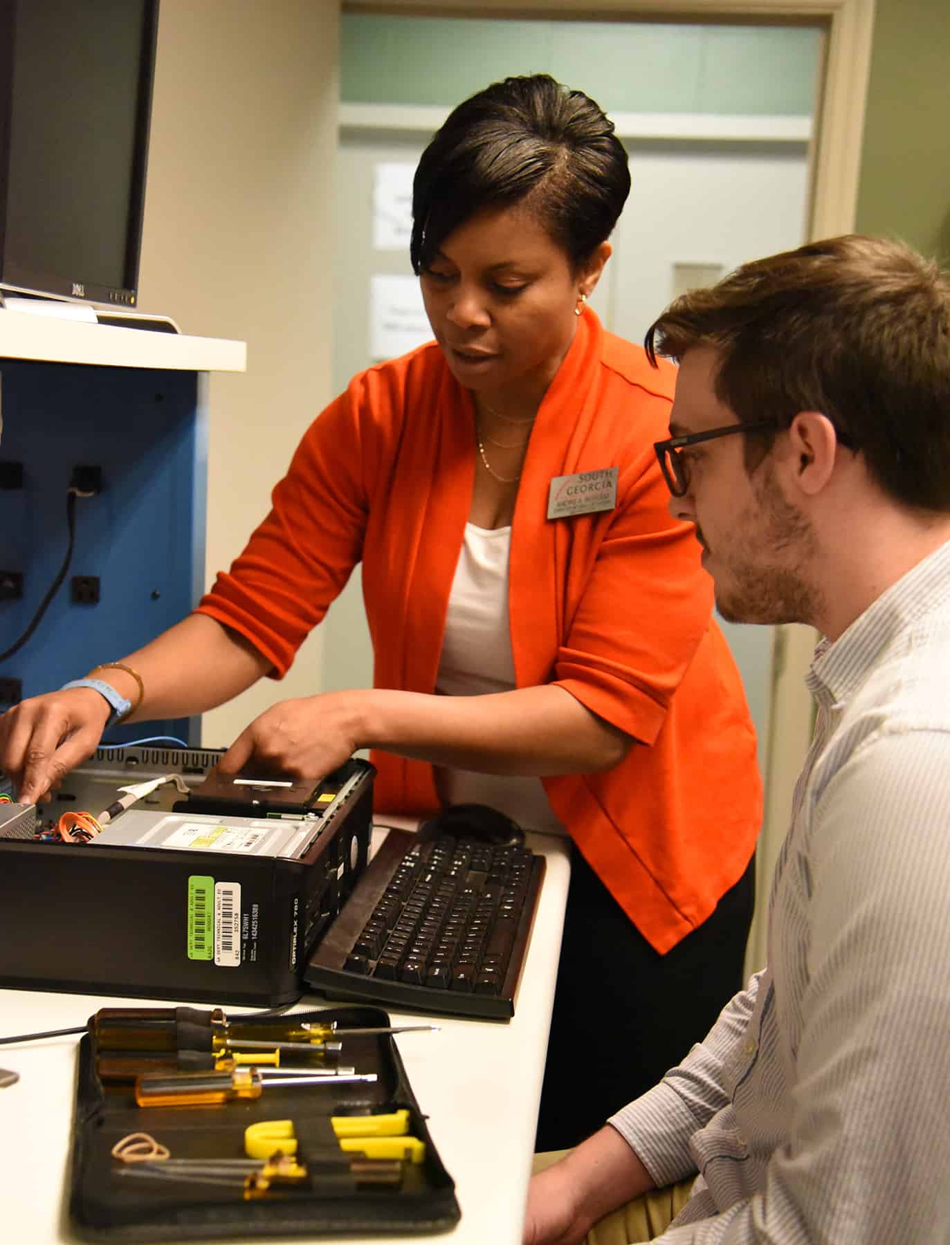 SGTC Americus CIS Instructor Andrea Ingram is shown above working with a student and showing him how to repair a computer.