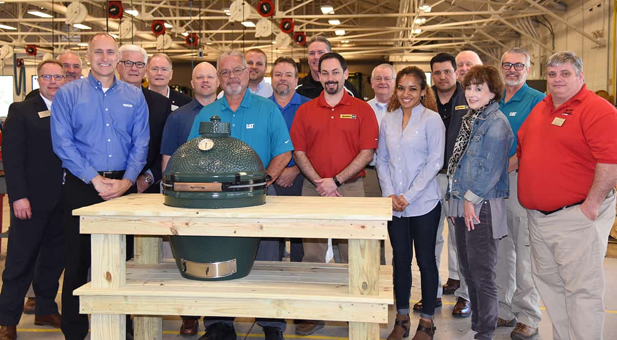 Retired South Georgia Technical College Caterpillar Heavy Equipment Dealers’ Service Technician Instructor Rick Davis (center) is shown above with the Caterpillar dealer’s and college officials. The CAT dealers’ presented him with a Big Green Egg cooker and table for his retirement. Shown above with Davis are: SGTC Vice President of Academic Affairs David Kuipers, SGTC Instructor Donald Rountree, Jim Larson with Yancey, SGTC’s Raymond Holt and Don Smith, Ashley Self of Thompson Tractor, Rick Davis, Kyle Hartsfield and Jeff Cornwell of Yancey, Tony Tice of Thompson Machinery, Duane Gabehart of Stowers Machinery, Phillip Welch of Thompson Machinery, Jessica Winters of Thompson Tractor, Able Posada of Ring Power, Bob Bacon of Thompson Tractor, Teresa Odom of Puckett Machinery, Scott Suttle of Thompson Tractor and SGTC EPG Instructor Keith McCorkle.
