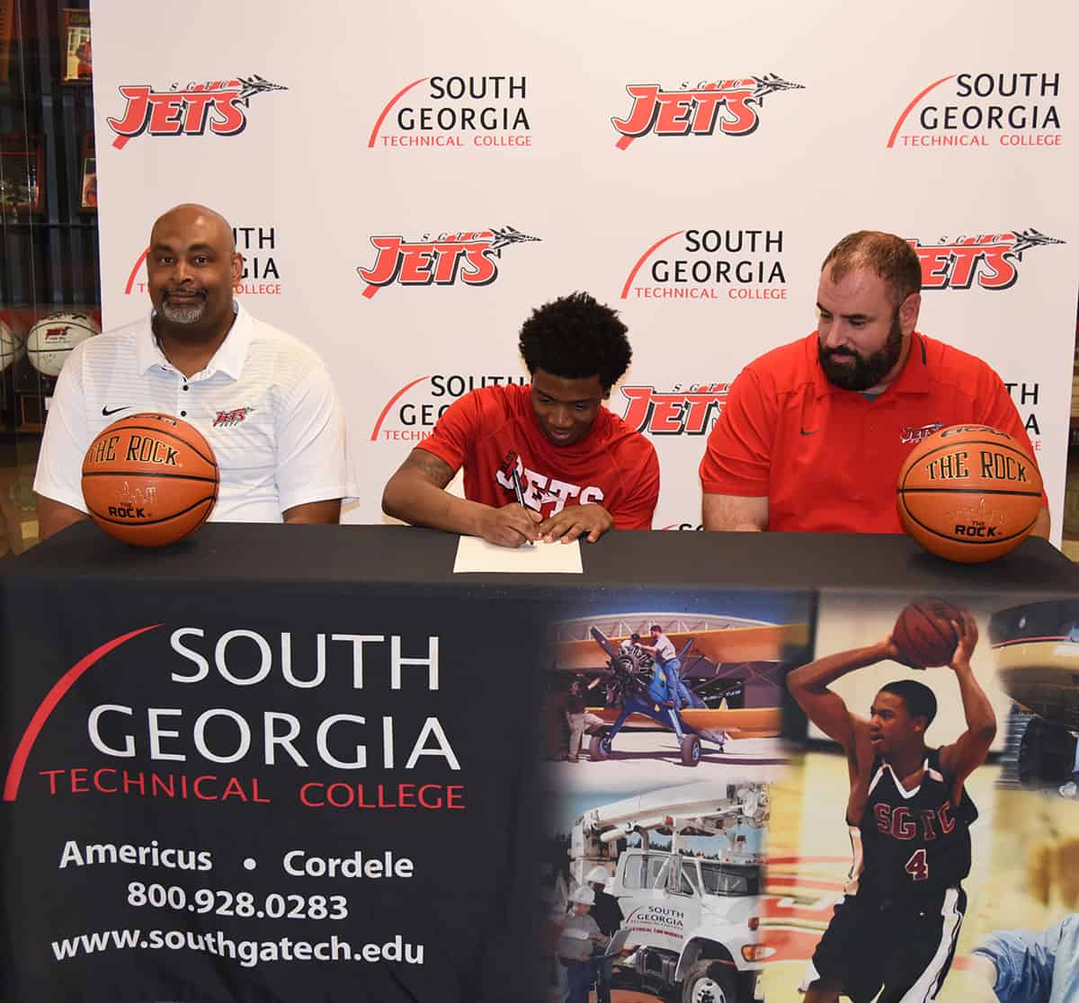 South Georgia Technical College Jets head coach Travis Garrett is shown above (l to r) with Rico Simmons, who is signing a letter of intent to play basketball at Mississippi Valley State University, and Jets assistant coach Chris Ballauer.