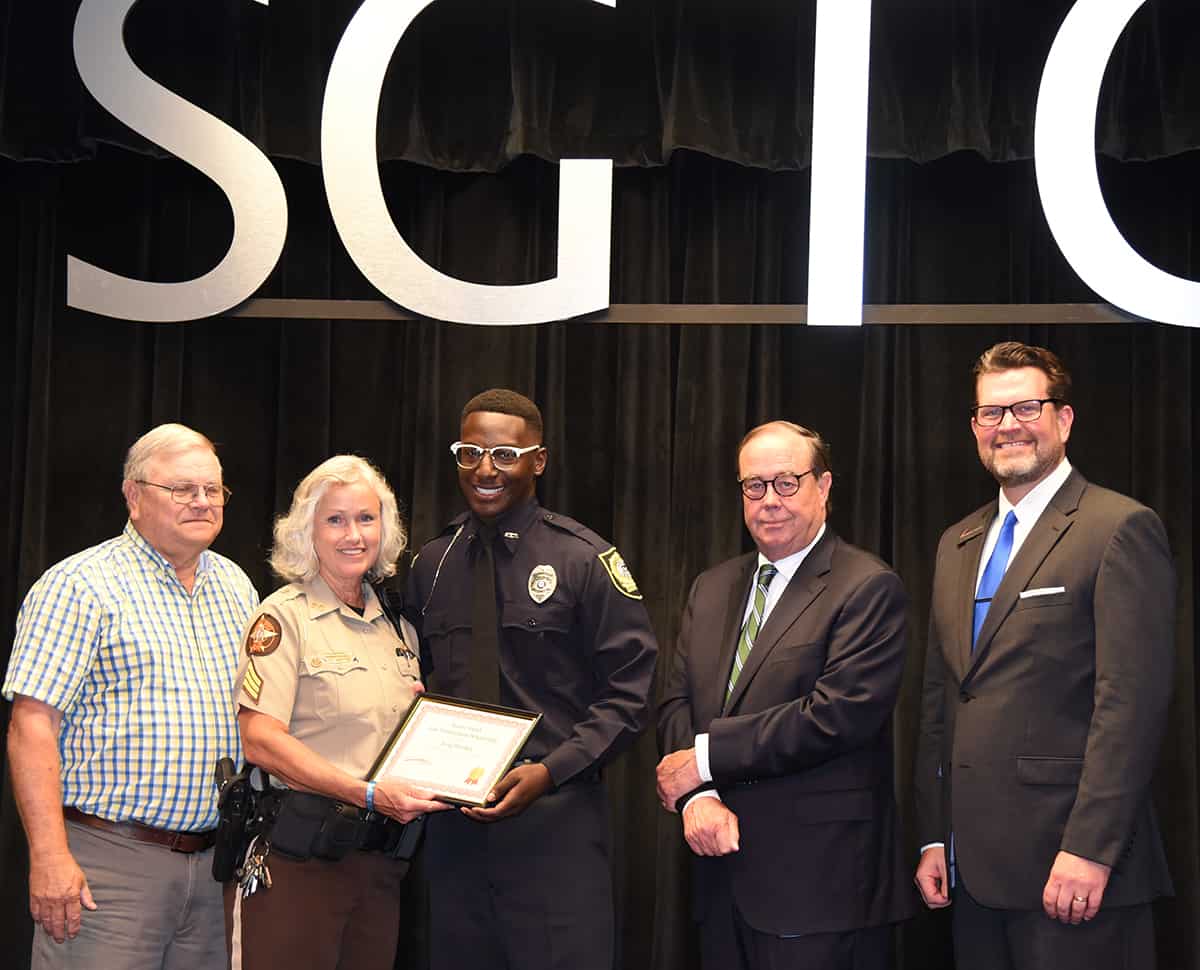 Paul and Sharon Smith Johnson are shown above recognizing King Mitchell of Americus with the Smarr-Smith Law Enforcement Academy Scholarship as SGTC Foundation Trustee and retired Judge George Peagler and SGTC President Dr. John Watford look on. Mitchell has been hired as a police officer with the Americus Police Department.