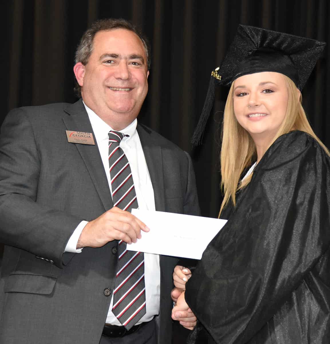 Paul Farr, Board member of the Americus Sumter County Chamber of Commerce and Director of Business and Industry Services at South Georgia Technical College (l), is shown above with Alanna Yawn (r), the Chamber of Commerce 2018 Platinum Trustee Scholarship winner. The scholarship is sponsored by the Platinum Trustees of the Chamber of Commerce.
