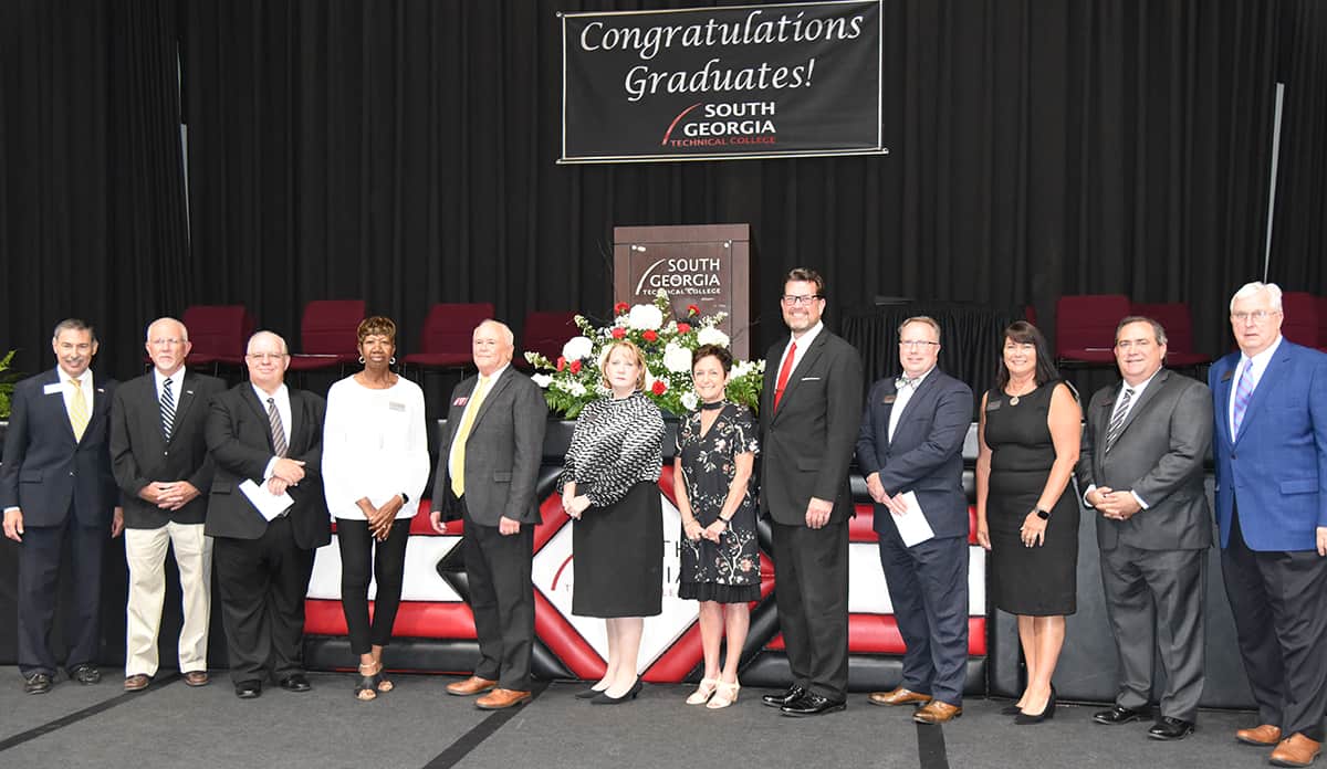 South Georgia Tech GED Graduation Officials - Shown above (l to r) are South Georgia Technical College Foundation Trustee and State Board of Education member Mike Cheokas, SGTC Board of Director Jake Everett, Rev. Mike Truitt, SGTC Board member Janet Siders, State Representative Bill McGowan, South Georgia Technical College Vice President of Administrative Services Lea Coe, Academic Dean for Adult Education Lillie Ann Winn, SGTC President Dr. John Watford, Vice President of Academic Affairs David Kuipers, SGTC Vice President Student Affairs and Institutional Support Karen Werling, Chamber of Commerce Board member and SGTC Director of Business Services Paul Farr, and SGTC Vice President of Economic Development Wally Summers.