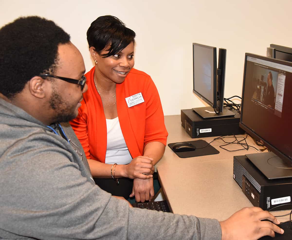 South Georgia Technical College Computer Information and Networking Specialist Instructor Andrea Ingram is shown above with a student enrolled in the CIS program. Computer Information and Networking Specialist programs are one of the many STEM career programs offered at South Georgia Technical College.
