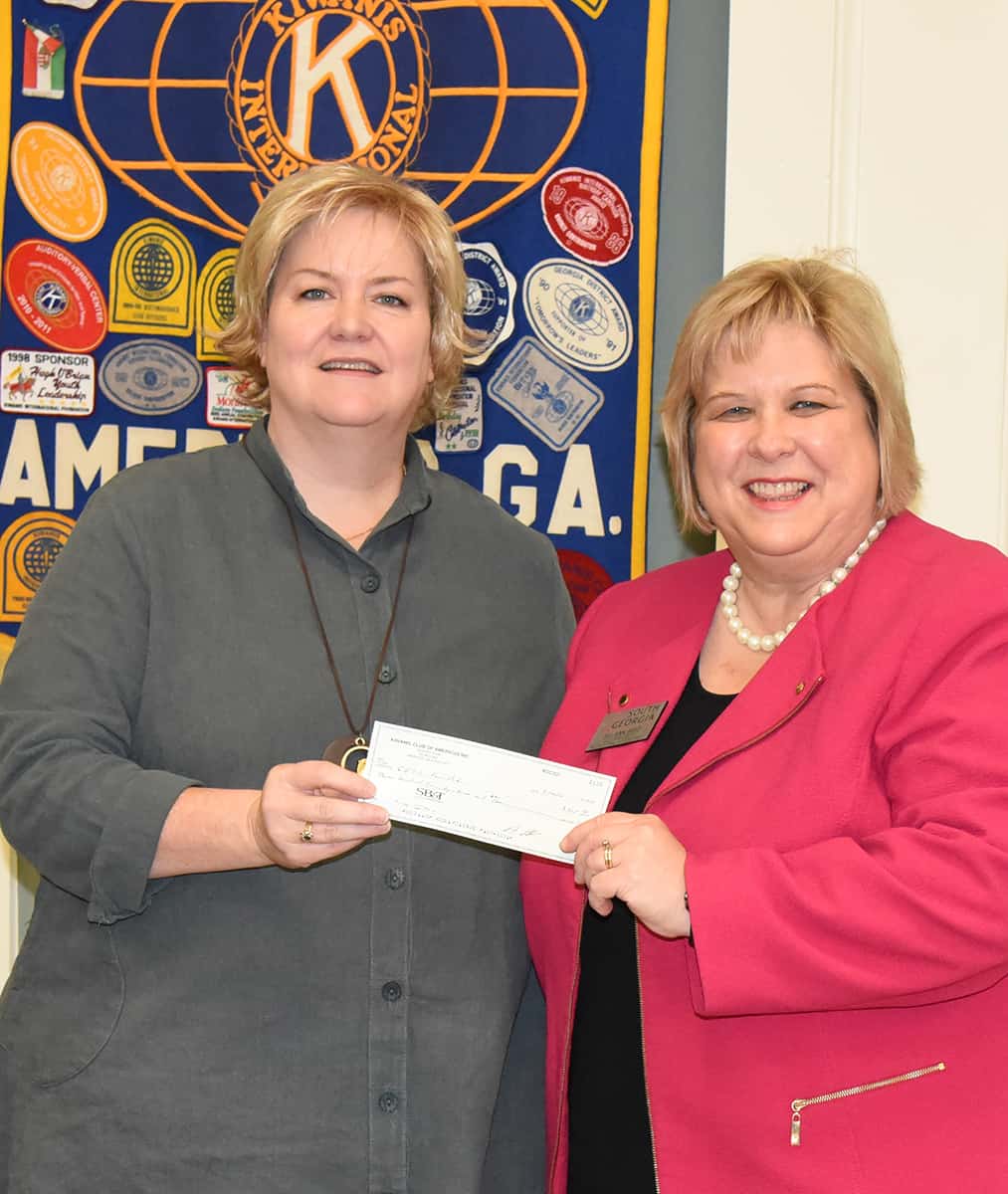 Shown above (l to r) are Anne Isbell, President of the Americus Kiwanis Club, presenting SGTC Foundation Executive Director Su Ann Bird with a donation for the SGTC Foundation and the Jets Booster Club.