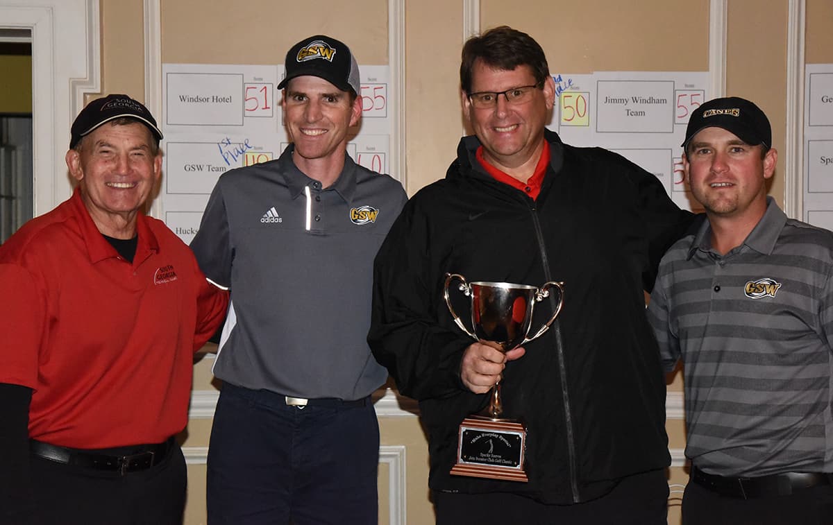 South Georgia Technical College President Emeritus Sparky Reeves, and SGTC Athletic Director James Frey are shown above with the first place GSW team of Stephen Snyder and Coach Darcy Donaldson.