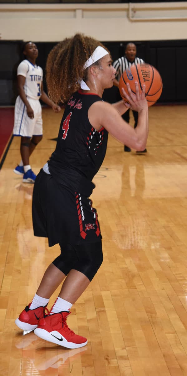 Alyssa Nieves, 4, is shown above putting up a three pointer to lead the Lady Jets to a win over St. Petersburg.